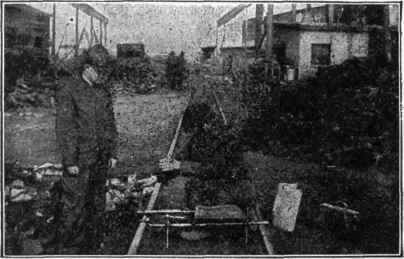 Fig. 66.   Taking Test Borings of Pig Iron. Various parts of the bar are drilled and the borings thus obtained are mixed and analyzed.