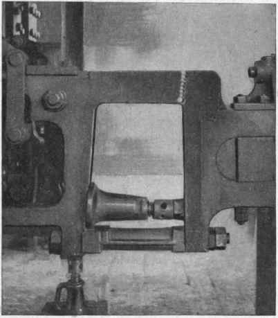 Fracture on locomotive frame, opened up by drilling and held in place by jacks in preparation for thermit welding