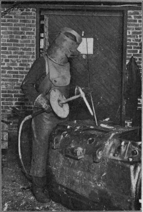 Operator welding with Bernardos arc process. (Courtesy proceedings of the Engineering Society of western Pennsylvania, May, 1909, C. B. Auel.)