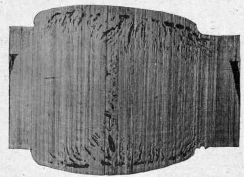 Reproduction of photograph of a weld showing blow holes