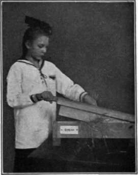 Fig. 107. Flax breaking done by hand.