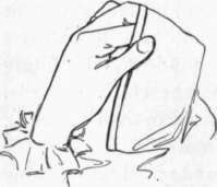 Fig. 13. The way to hold the cloth while hemming.