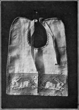 Fig. 93. The darning stitch makes the design of the rabbits stand out.