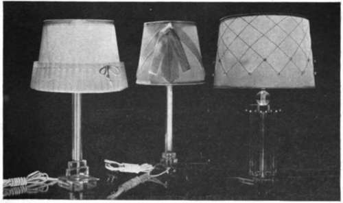 A Group Of Three Lamps Made Of Crystal Clear Material