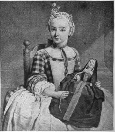 A picture showing a child playing with a grown up doll in the habit of a nun.