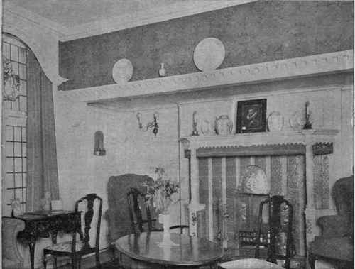 An effective panelled interior with frieze of handsome wallpaper . Wanring