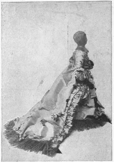 Wax doll dressed as a Court lady of the time of Louis XVI.; painted brocade dress. 10 1/2 inches. Such dolls are rare and extremely valuable.