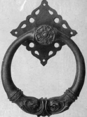 A fine example of a modern hand wrought brass knocker, simple but dignified in treatment
