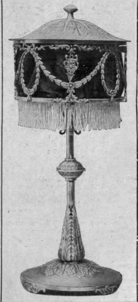 A lamp in silvered copper, hand'wrought and of exquisite design, fashioned by the members of the Duchess of Sutherland's Cripples' Guild, Ltd.