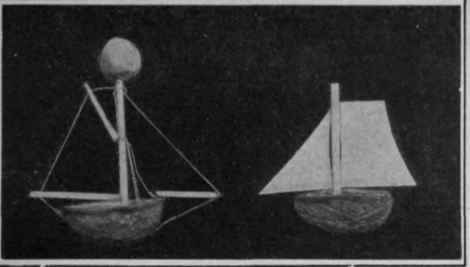 A sailing boat and a lightship, constructed from walnut shells, a Barcelona nut and matches