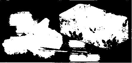 A weighted pincushion is a necessity in a workroom. The illustration shows one made on the top of a brick and covered with cretonne special mark on all their paper patterns, so that they do not get mixed.