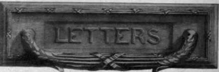 An artistic letter plate, with handle decorated with ribbon and reed border in the