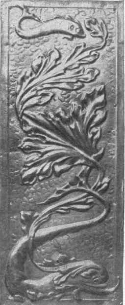 An artistically wrought panel that, in copper or brass, would serve admirably for the finger plate of a door
