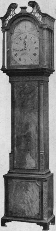 Fig. 2. Beautiful mahogany grandfather clock with metal dial, Chippendale,with Corinthian pillars and carving. An arched top to the dial dates from the eighteenth century