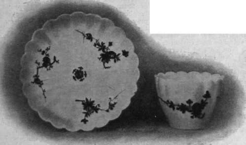 Fluted cup and saucer of Bow porcelain, decorated with flowers painted in the Japanese style. The paste of this porcelain is soft, and resembles that of Chelsea china, though often heavier and thicker