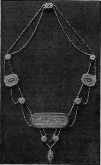 Necklace of Wedgwood plaques in pale and dark blue jasper. The chains are of silver and the raised designs and figures are in white of its glory, and Flaxman was designing for him from Greek models.
