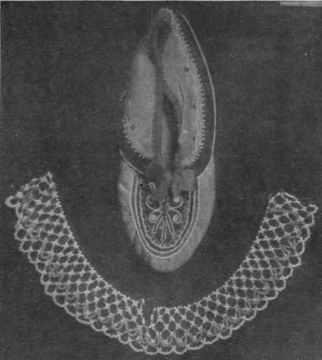 Chamois leather slipper worked with minute Indian beads. Turn down collar formed entirely of crystal and chalk white beads