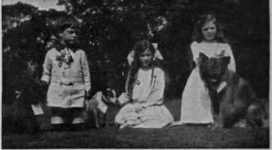Three young prize winners and their exhibits