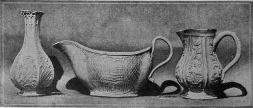 Vase, sauceboat and cream ewer, in Staffordshire salt glazed embossed ware of the 18th century. The art of salt glazing was introduced into England by the brothers Elers about 1690 From the South Kensington Museum