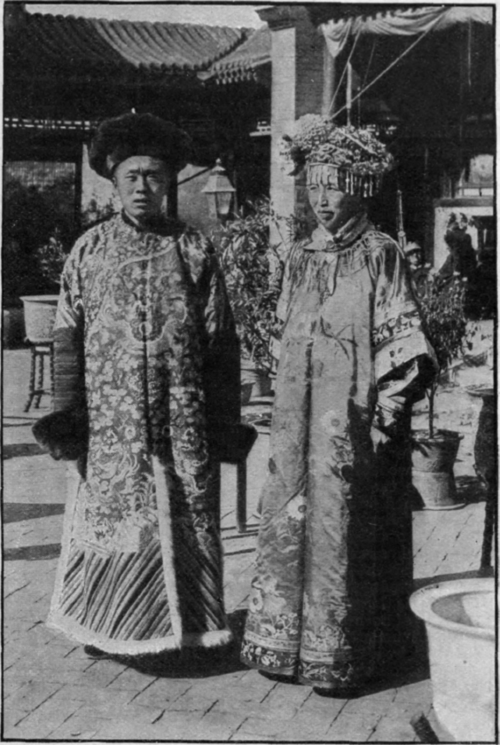 A Manchu bride and groom of the wealthy classes in wedding costume