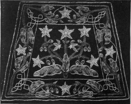 An original suggestion for a tea cosy. The design is a conventionalised pattern worked in natural colours upon black cloth. Aluminium thread is used for the interlaced corners and connecting lines of the design