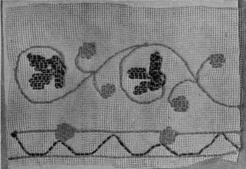 Shadow embroidery on filet net, worked in fine wool. Such a scheme would look well on a girl's evening frock of net