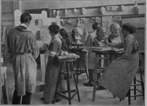 Students modelling under the direction of Mr. J. A. Stevenson. The more advanced members work direct from the living model