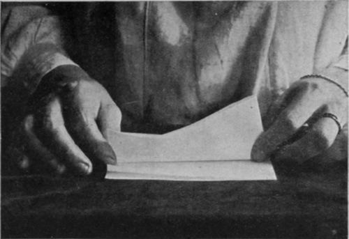 The paper is folded a second time in half, the lines being straightly defined