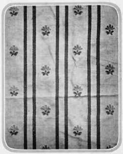 Éeru silk with stripe of crimson red. Sprig of darker écru and green.