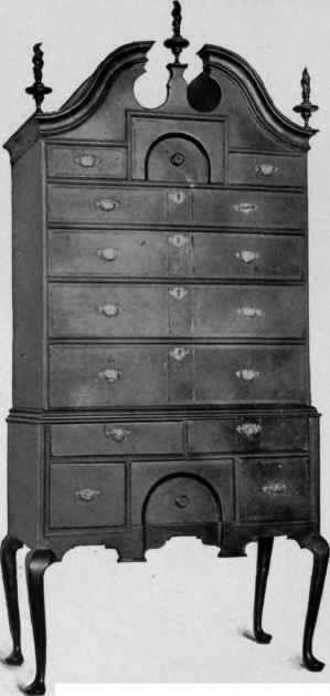 Scroll Top High Chest of Drawers, about 1725.