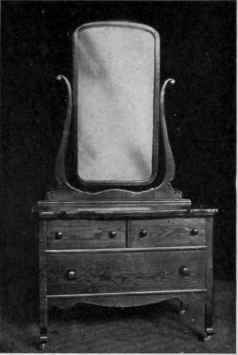 12. An oak dresser at $ 12.50, crowded with meaningless curves.