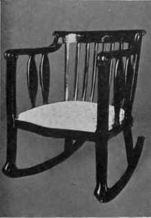 9. An arm chair in mahogany finish, part of a three piece set, at $ 65.