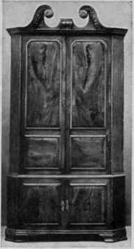 Cupboard with Swan neck Scroll Pediment, Veneered Doors, Fluted Canted Corners, Chinese Bracket Feet.
