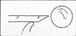 Fig. 183. Scraping the knob on the lathe.