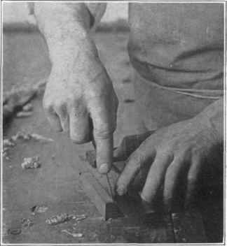 Fig. 35. Scoring with a knife along the try square.