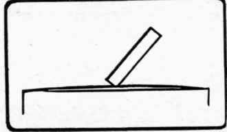 Fig . 92. Method of planing off chamfer on a thin piece of wood.
