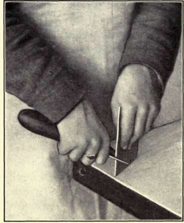 Fig. 78. Method oF Grasping Scraper for Sharpening.