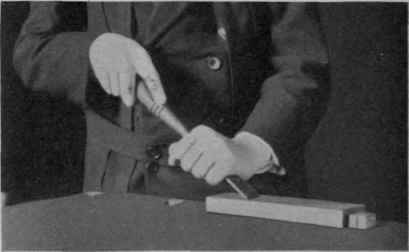 Fig. 22. Whetting the Beveled Side of a Chisel.