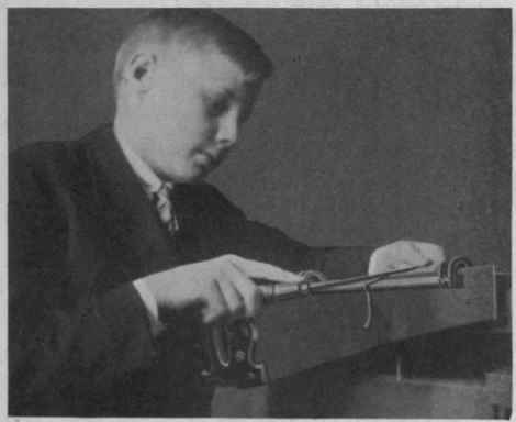 Fig. 25. Filing a Saw.