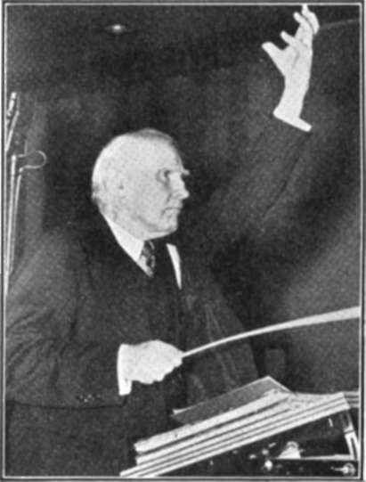 Walter Damrosch Conducting An Orchestra During A Broadcast