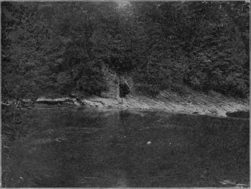 Drag of strata near fault plane. (U. S. G. S.) The hole is an artificial opening along the fault.